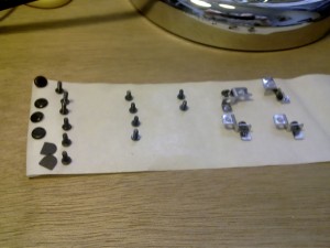 Use masking tape to hold screws when repairing a laptop